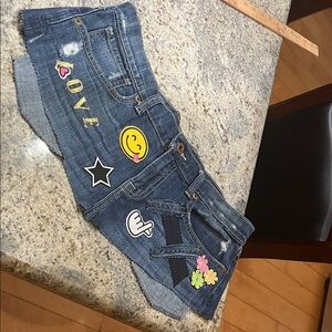 Denim pocket belt with Fun Patches. Waist size is 29”..size 8.